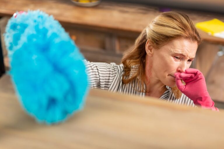 distressed person wearing a glove and dusting